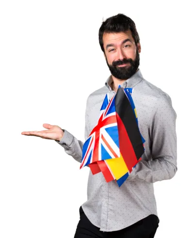 Handsome man with beard holding many flags holding something